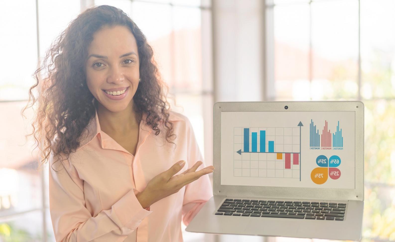 Business owner reviewing improved financial reporting system